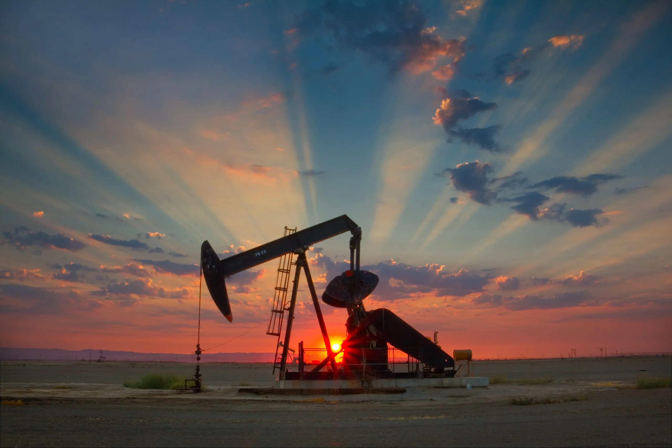 Oil pumpjack at sunset